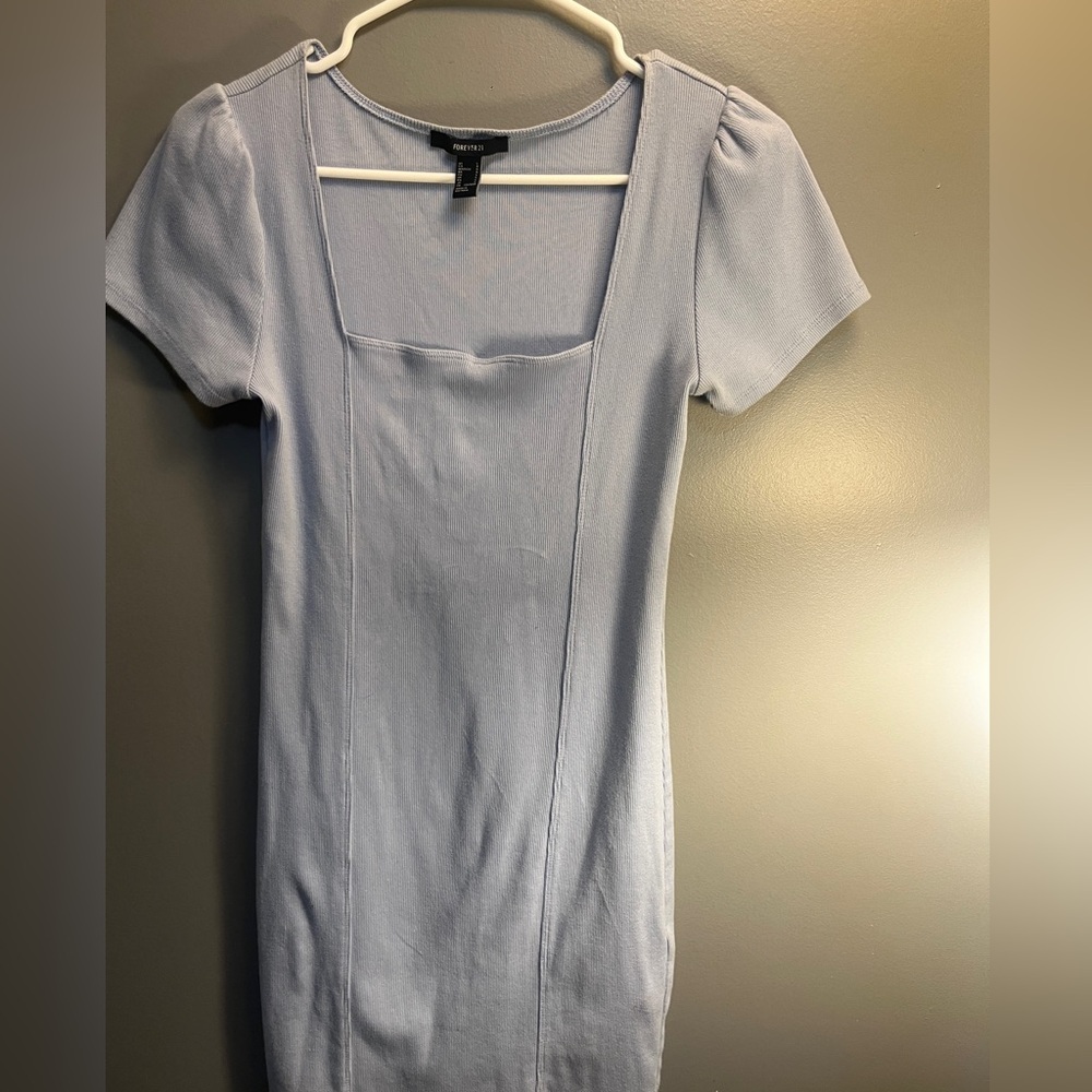 Light blue Forever 21 dress. Dress is very fitting and defines your body type .